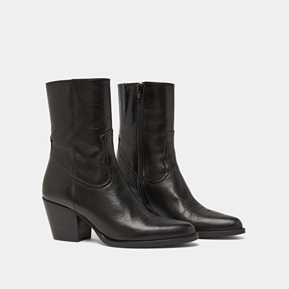 Heeled ankle boots with topstitch in black leather | DJAMENA