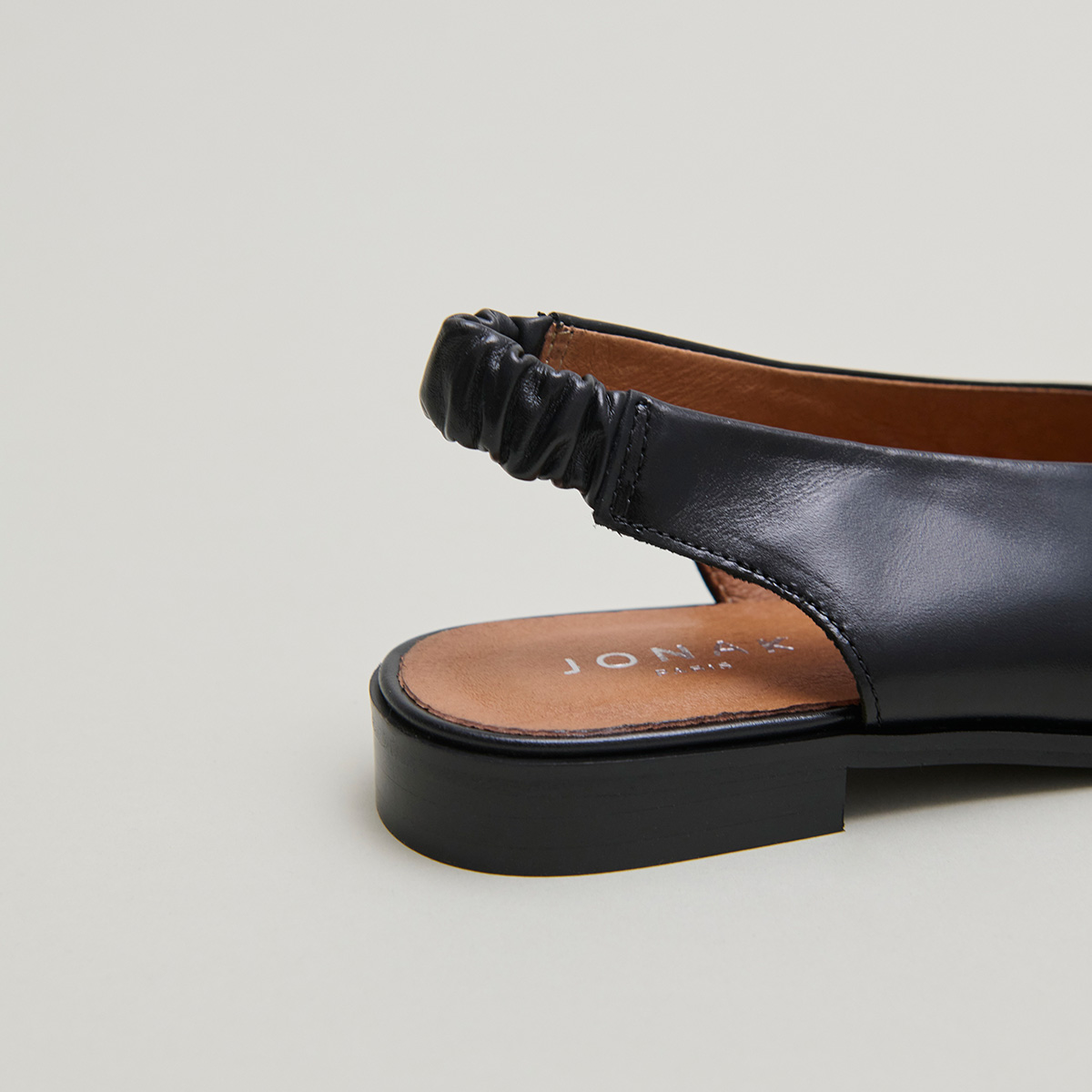Ballet flats with open backs in black leather | ACAJOU