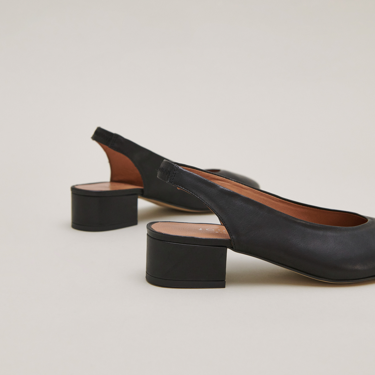 Ballet flats with open backs in black leather | VINCE