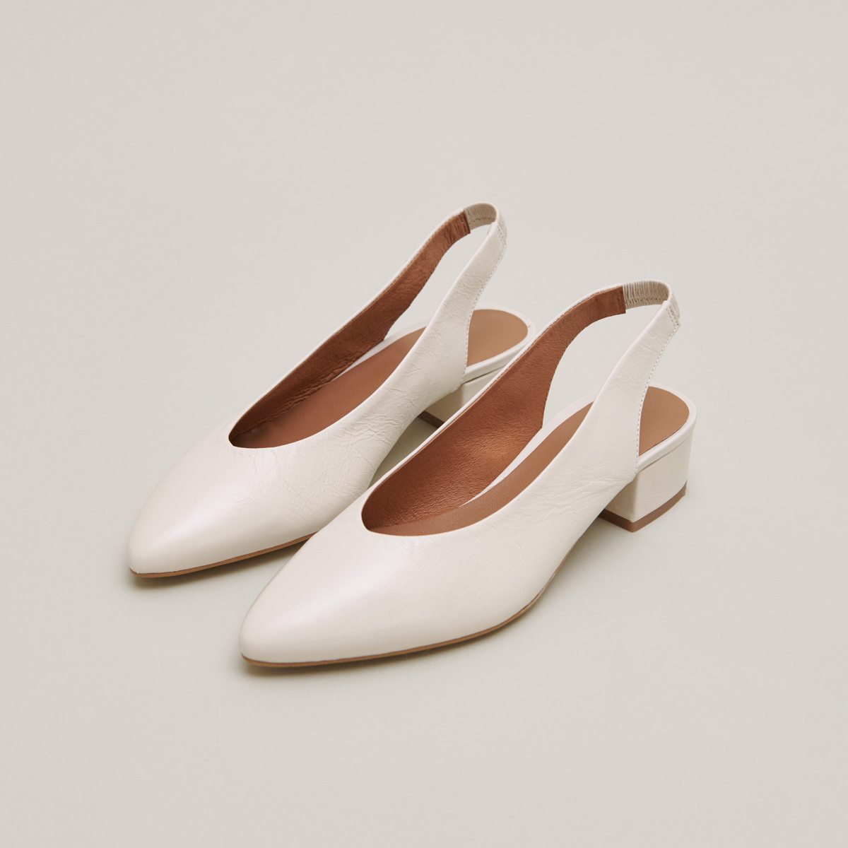 Ballet flats with open backs in ecru distressed leather | VINCE
