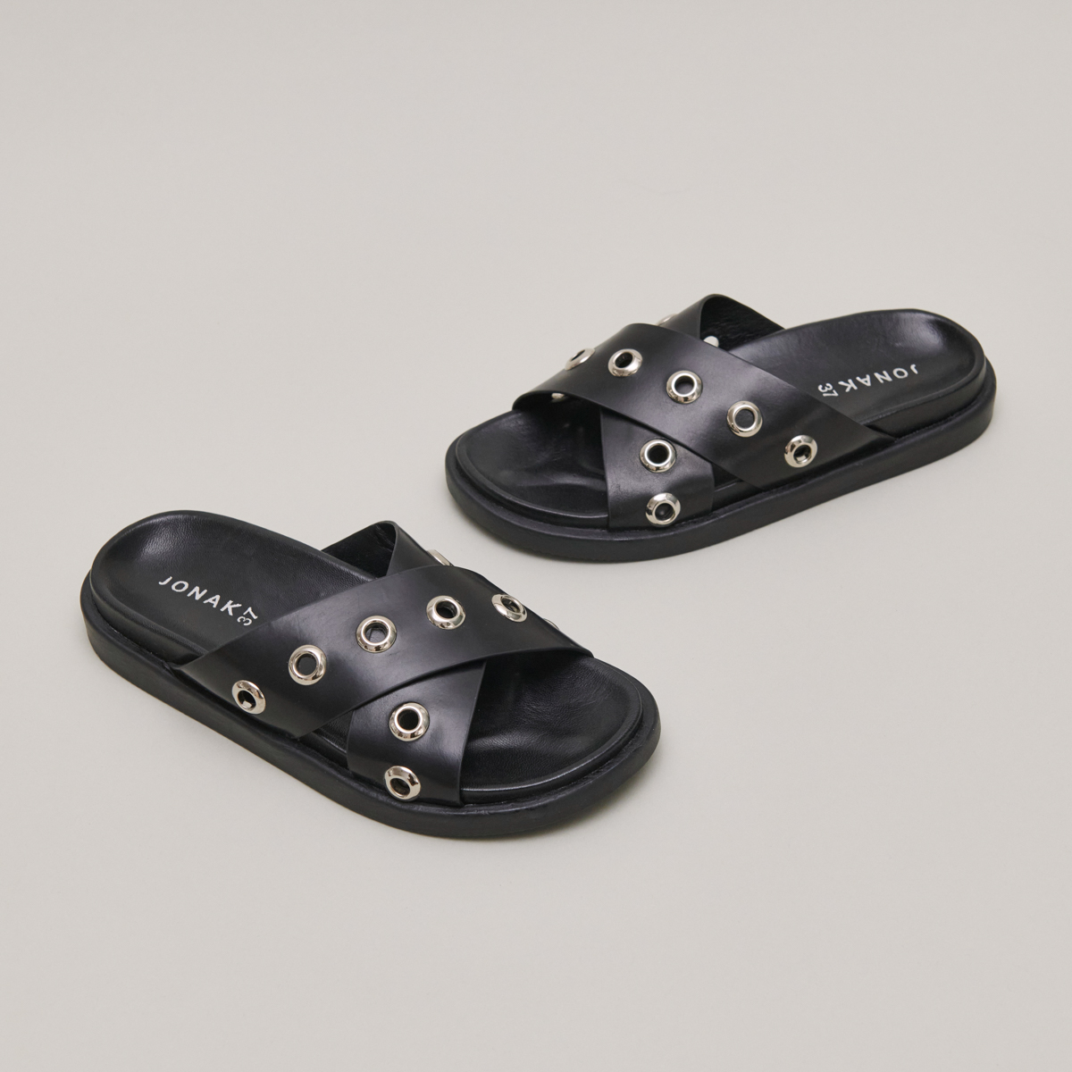 Open-toe mules with silver details in black leather | WYOMING