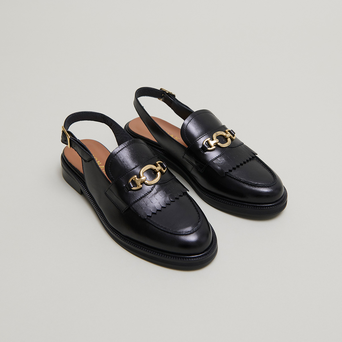 Loafers with open backs in black leather | DELPHY