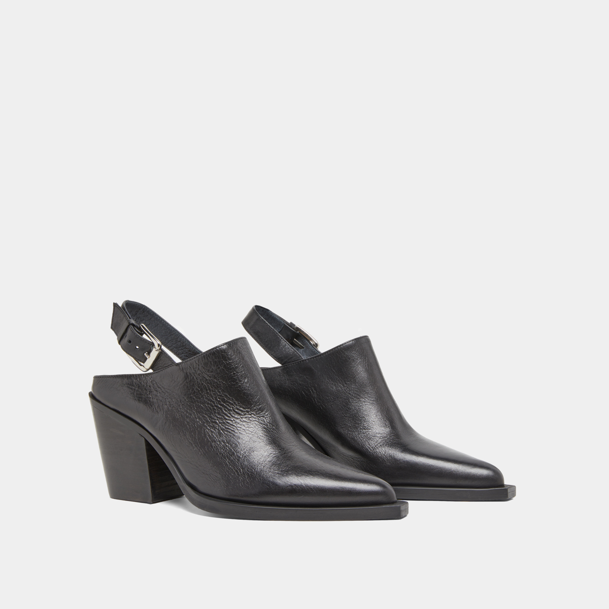 Mules with beveled heels in black leather | DOREN
