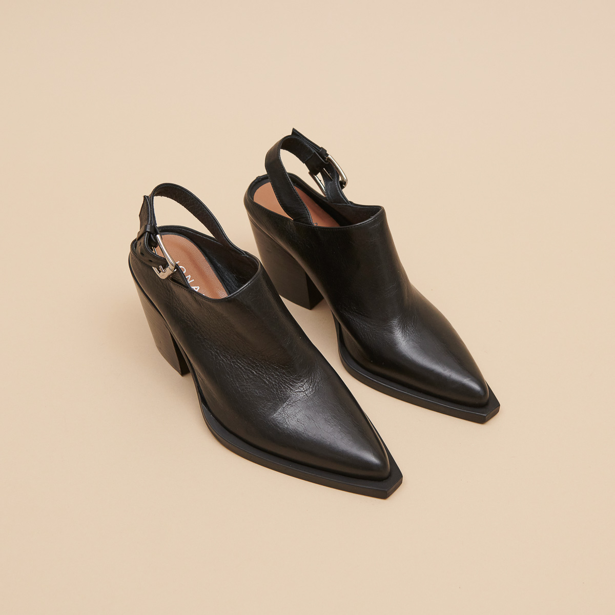 Mules with beveled heels in black leather | DOREN