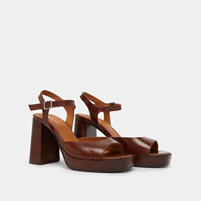 High-heeled sandals and platforms in brown leather | BAMBA