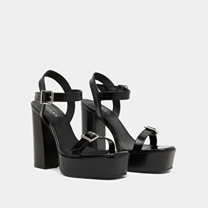 High-heeled sandals and platforms in black leather | BONHEUR
