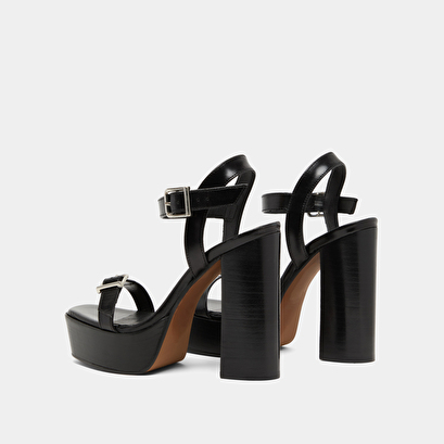 High-heeled sandals and platforms in black leather | BONHEUR