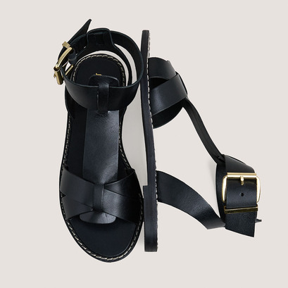 Buckle and strap sandals in black leather | whisper