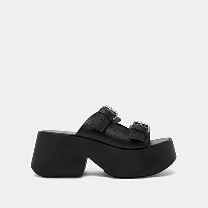 Mules with thick straps, buckles and open toes in black grained leather | ENOLA