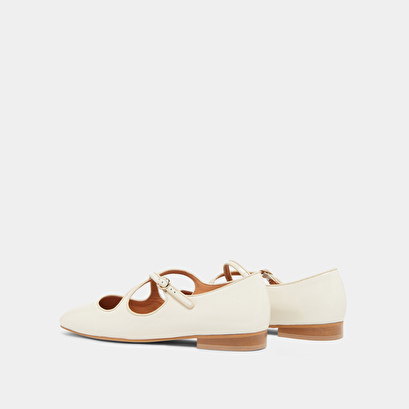 Ballet flats with crossed straps in ecru patent and ecru leather | ducky