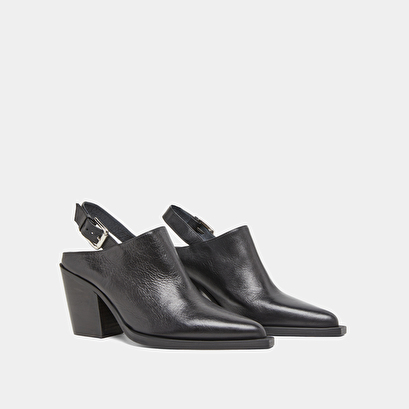 Mules with beveled heels in black leather | doren