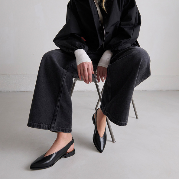 Ballet flats with open backs in black leather | ACAJOU