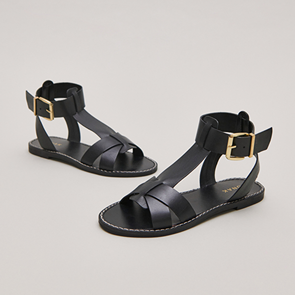 Buckle and strap sandals in black leather | WHISPER