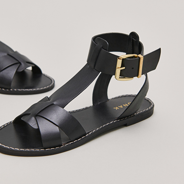 Buckle and strap sandals in black leather | WHISPER