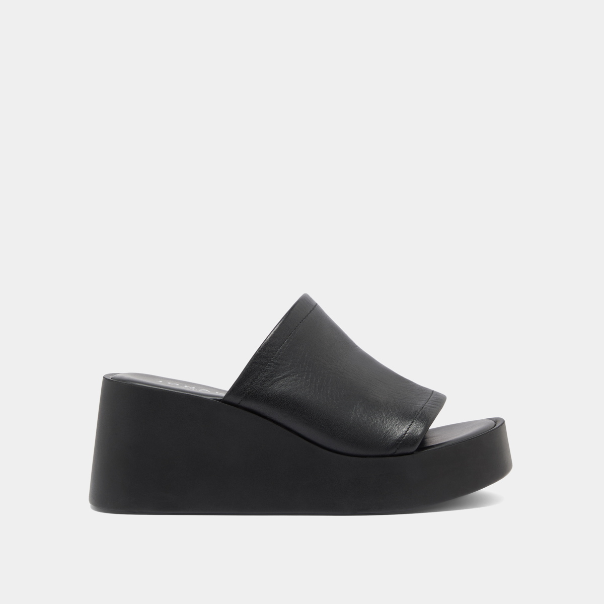 Wedge mules in black leather | EUGENE