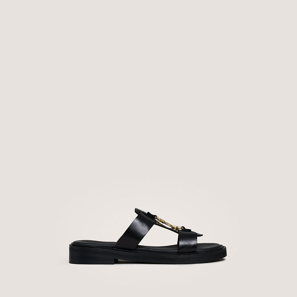 Mules with golden jaws in black leather | DOP