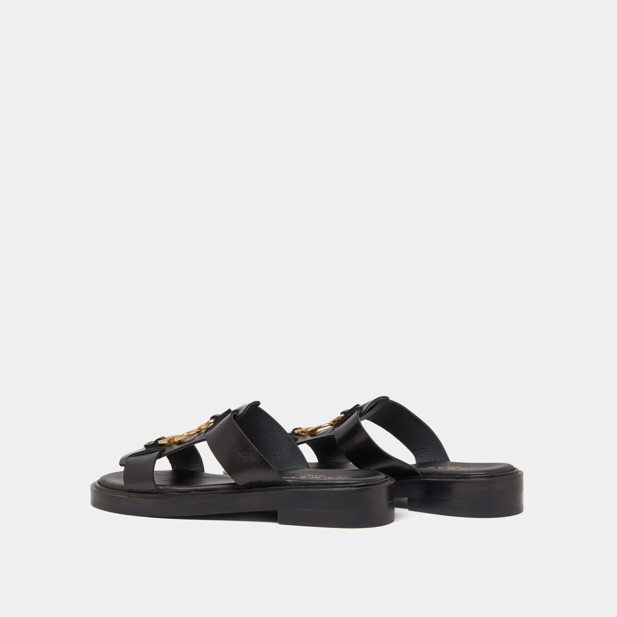 Mules with golden jaws in black leather | DOP