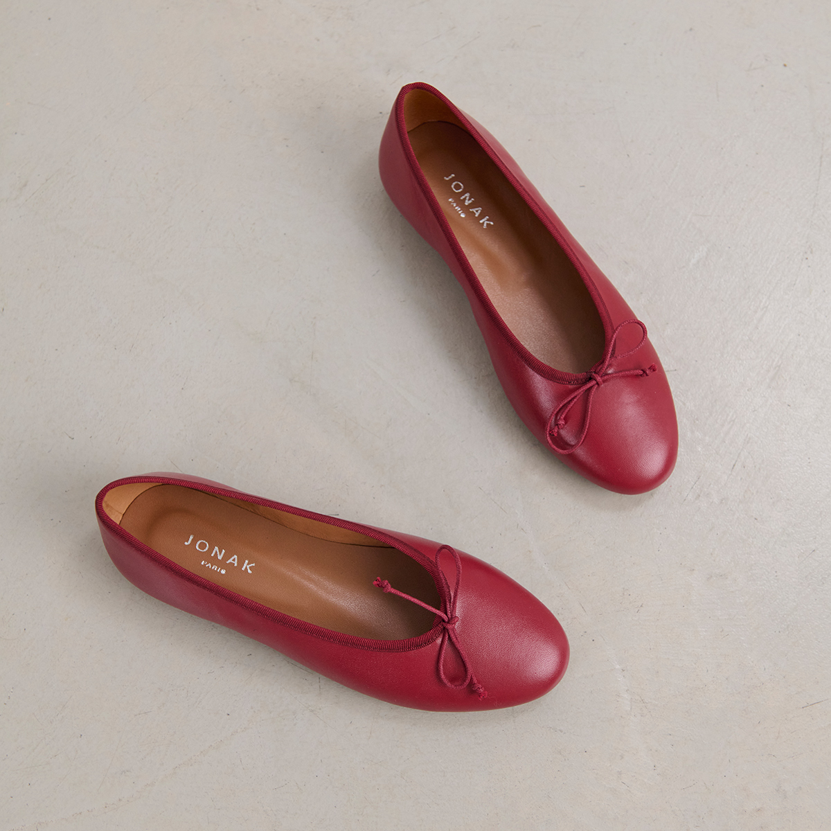 Ballet flats with laces in carmine red leather | DJERBA