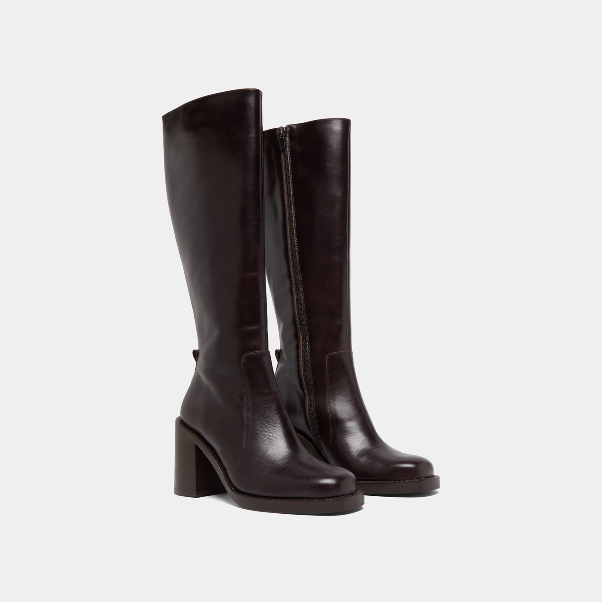 Boots with overflowing heels in dark brown leather | BRETZEL