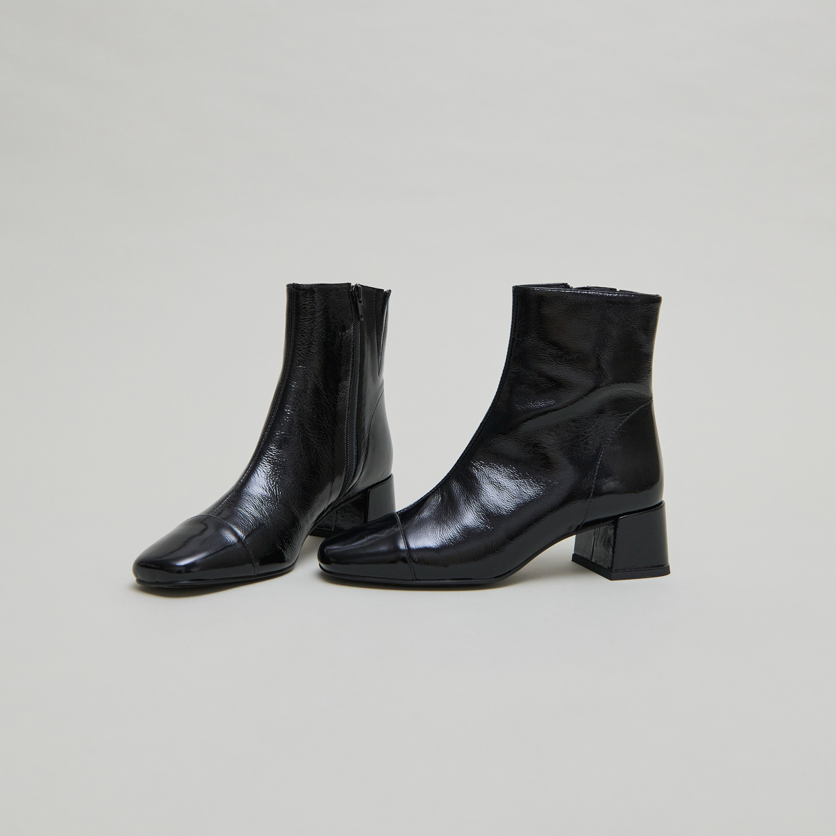 Ankle boots with zips in black pleated patent leather | DOMENICA