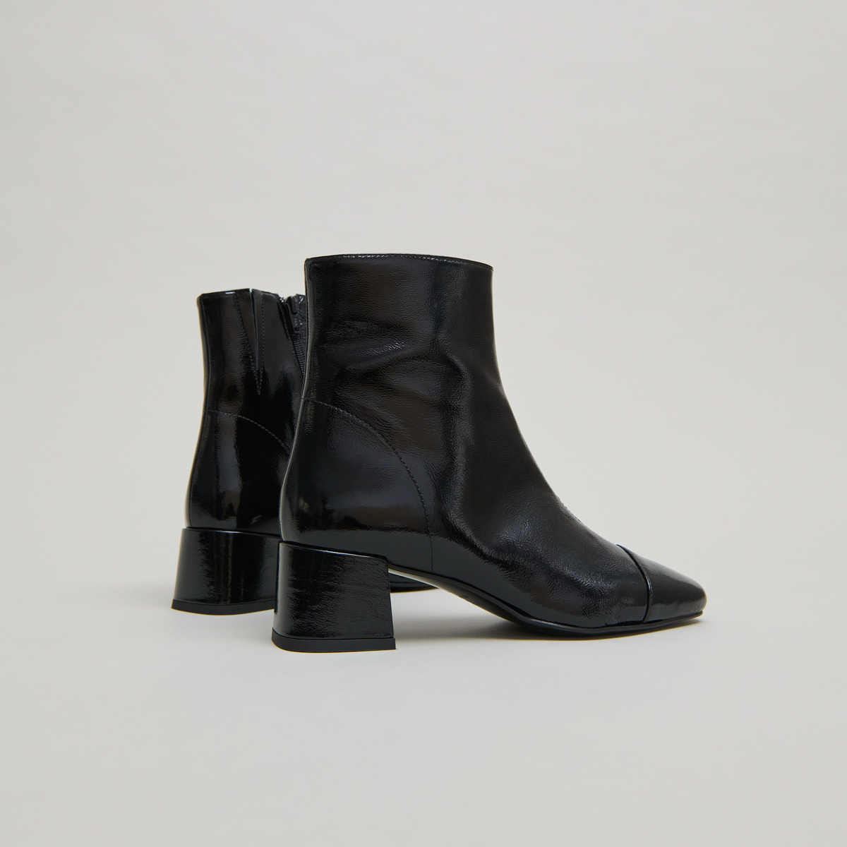 Ankle boots with zips in black pleated patent leather | DOMENICA