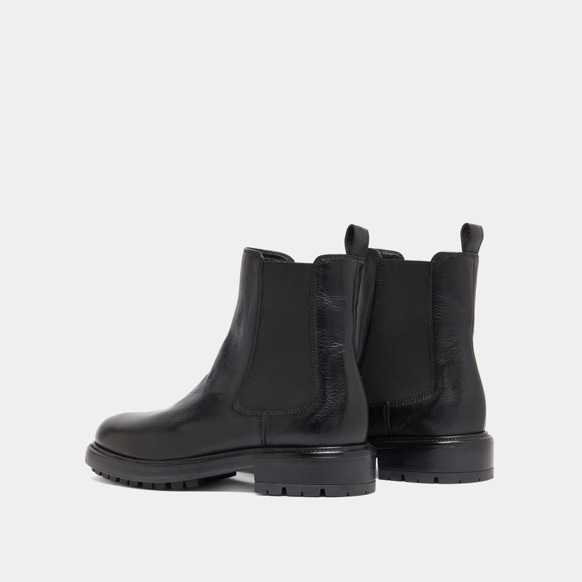 Lowboots with elastic straps and notched soles in black grained leather | CELINA