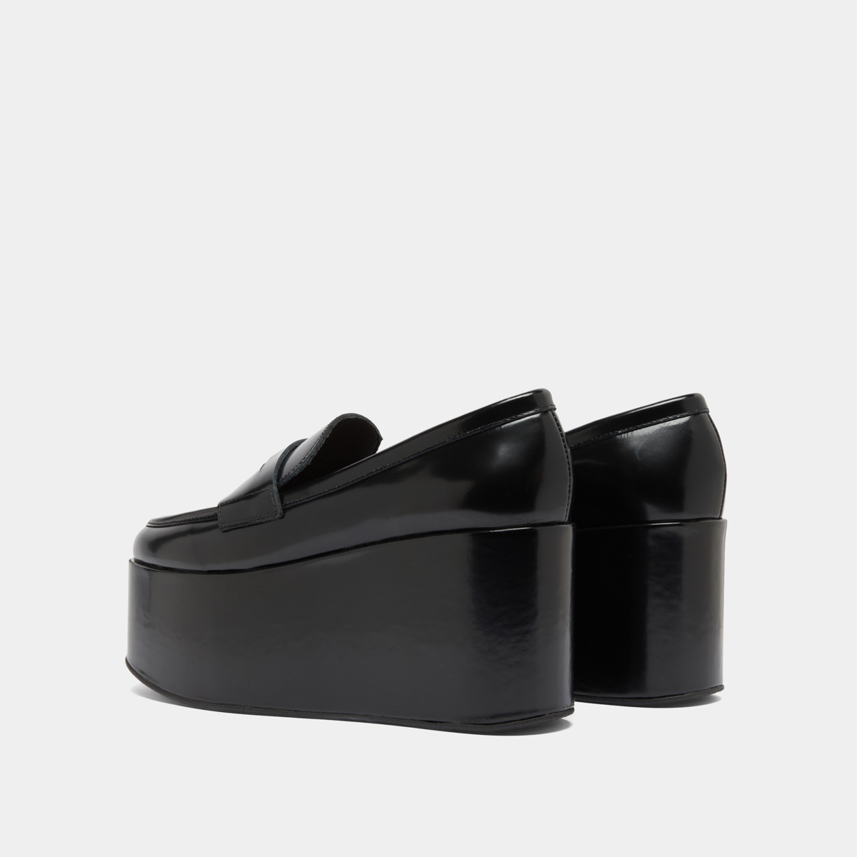 Mocassins à plateformes in black glazed leather | DOPO
