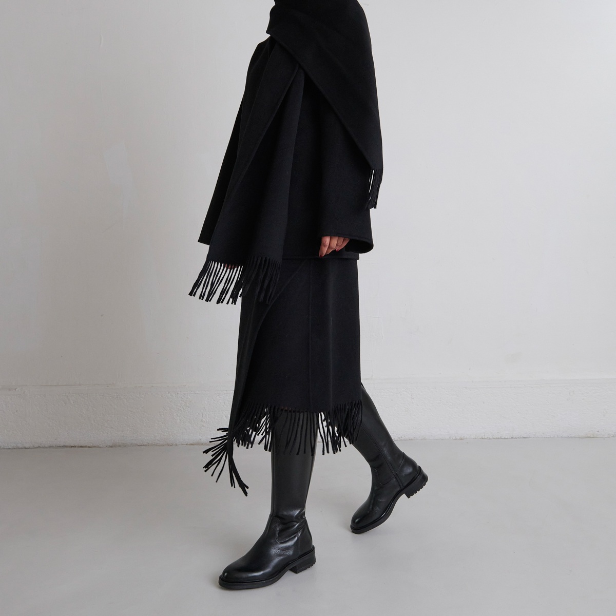 Bottes à talons crantés in black leather | GRACIANA