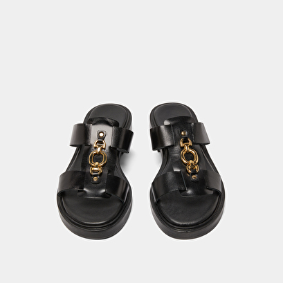 Mules with golden jaws in black leather | dop