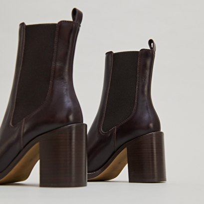 Ankle boots with overflowing heels in dark brown leather | bretz