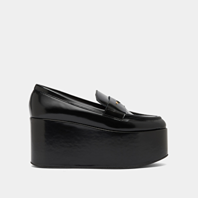 Mocassins &agrave; plateformes in black glazed leather | dopo