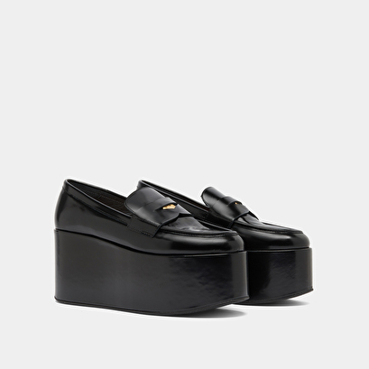 Mocassins &agrave; plateformes in black glazed leather | dopo