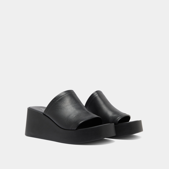 Wedge mules in black leather | EUGENE