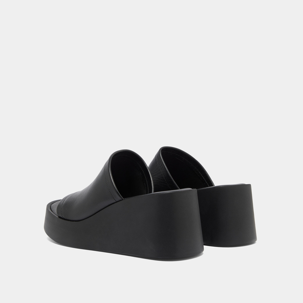 Wedge mules in black leather | EUGENE
