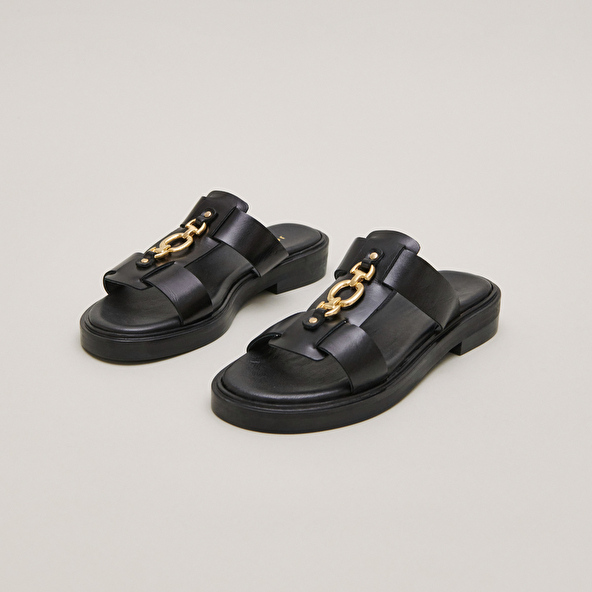 Mules with golden jaws in black leather | DOP