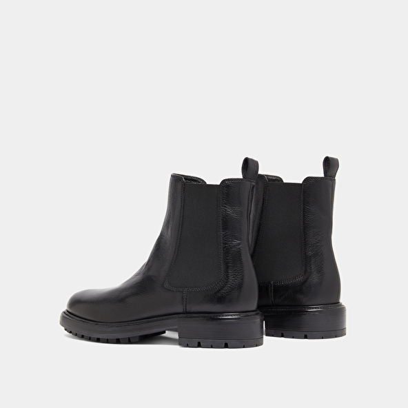 Lowboots with elastic straps and notched soles in black grained leather | CELINA