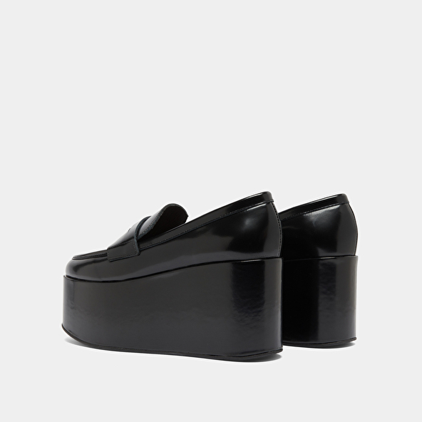 Mocassins à plateformes in black glazed leather | DOPO