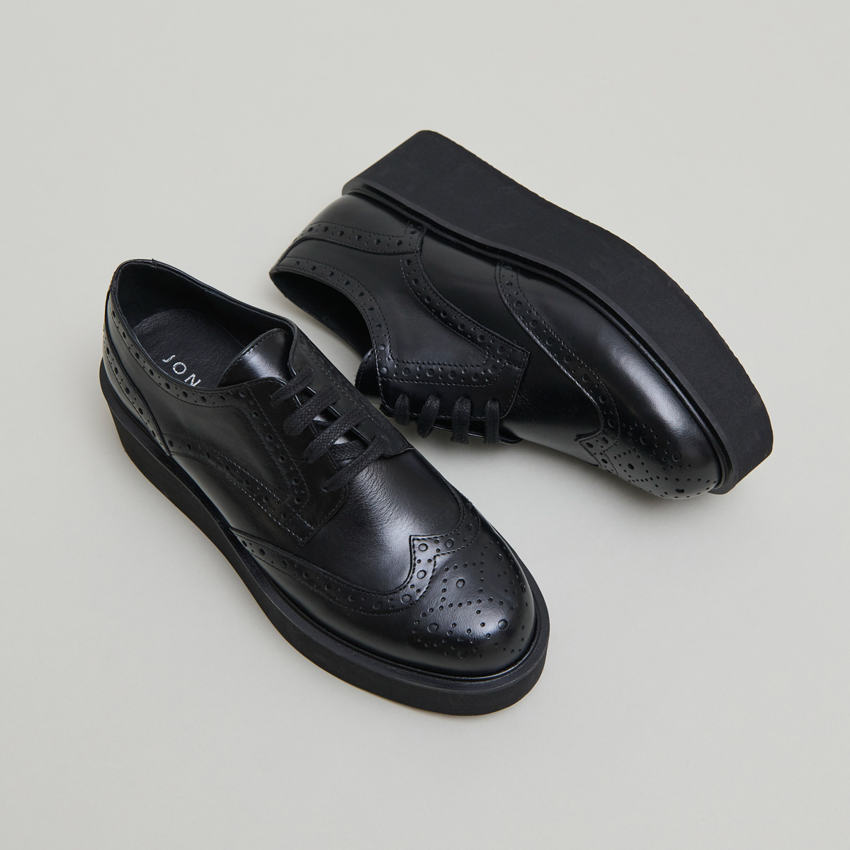 Derbies compensées in black leather | ADRIELLE