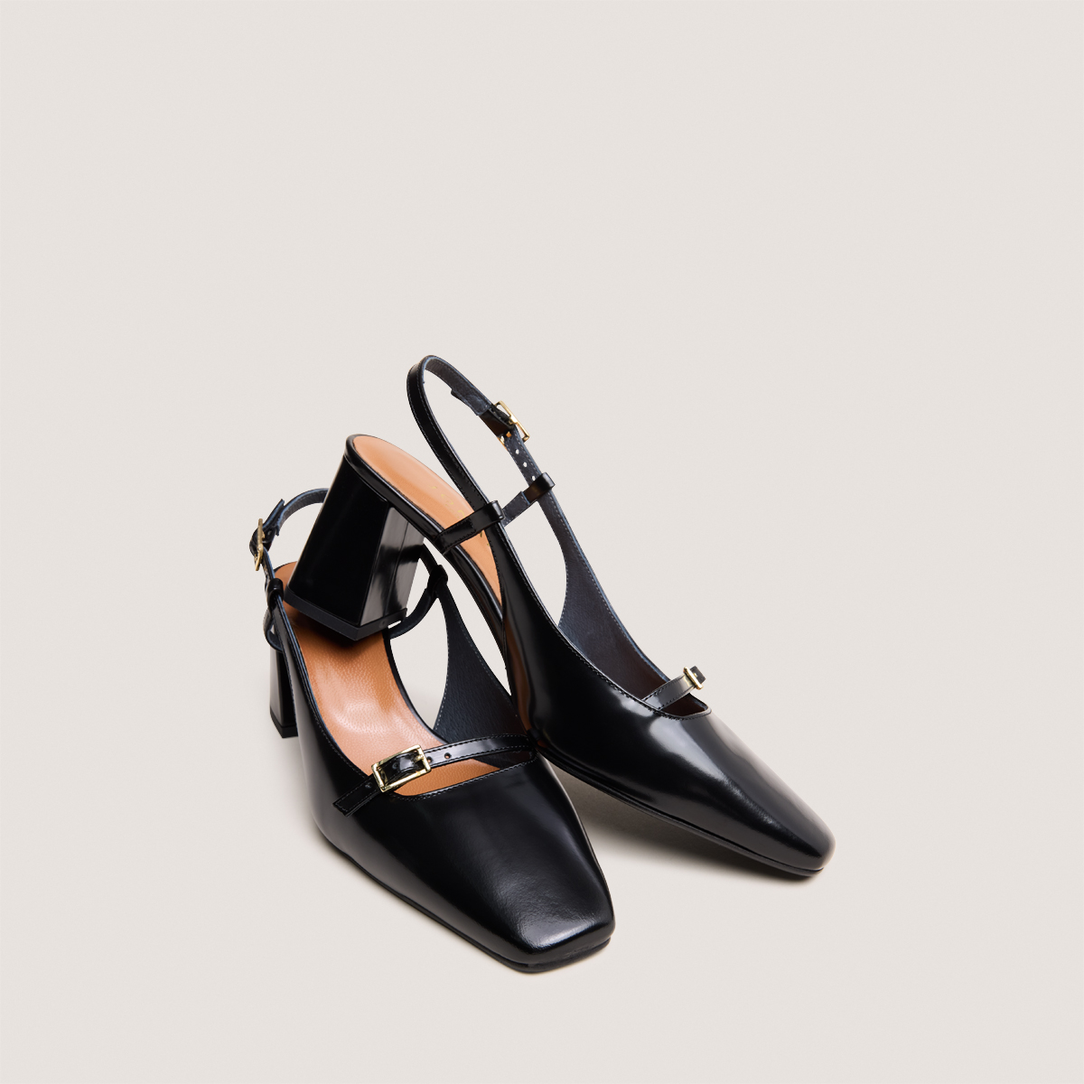 Heeled slingbacks in black glazed leather | DADELLE