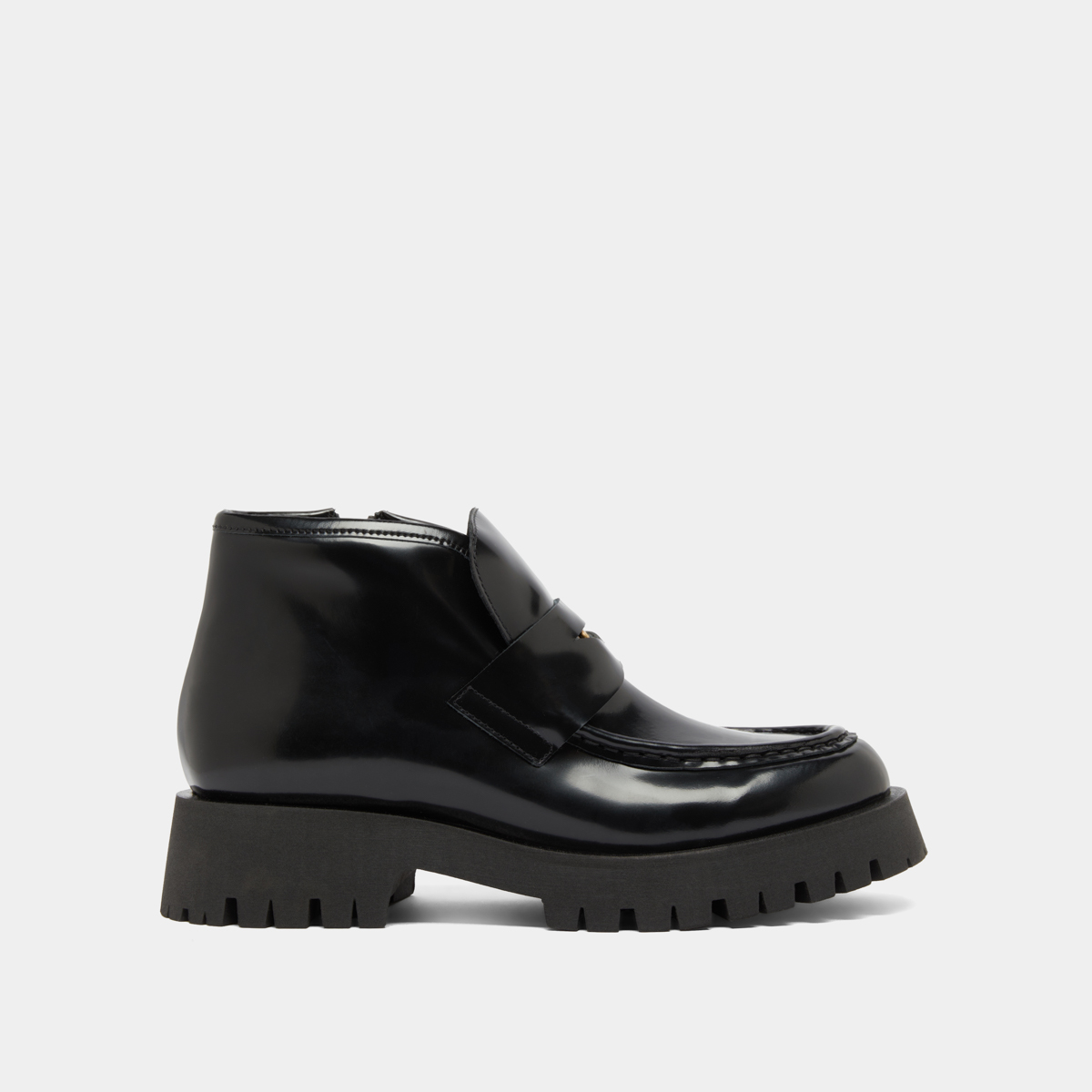 Boots à empiècements in black glazed leather | DESK