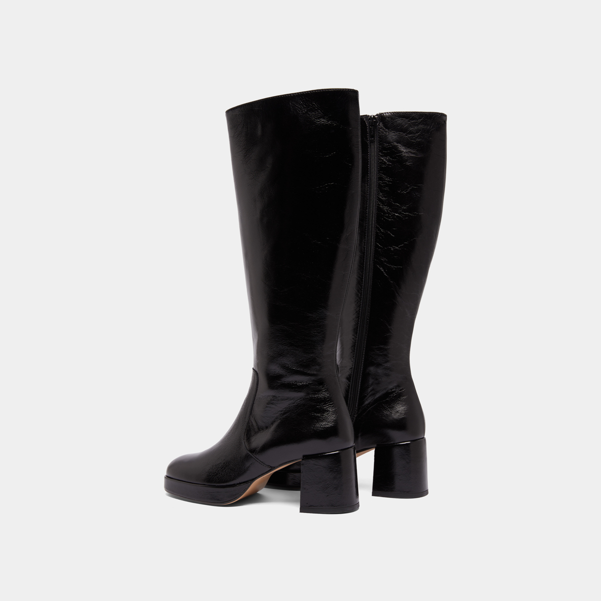Heeled platform boots in black distressed leather | VANEO