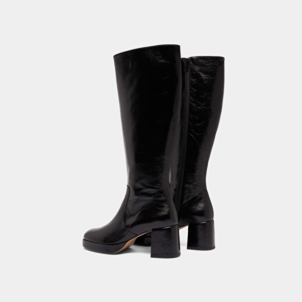 Heeled platform boots in black distressed leather | VANEO