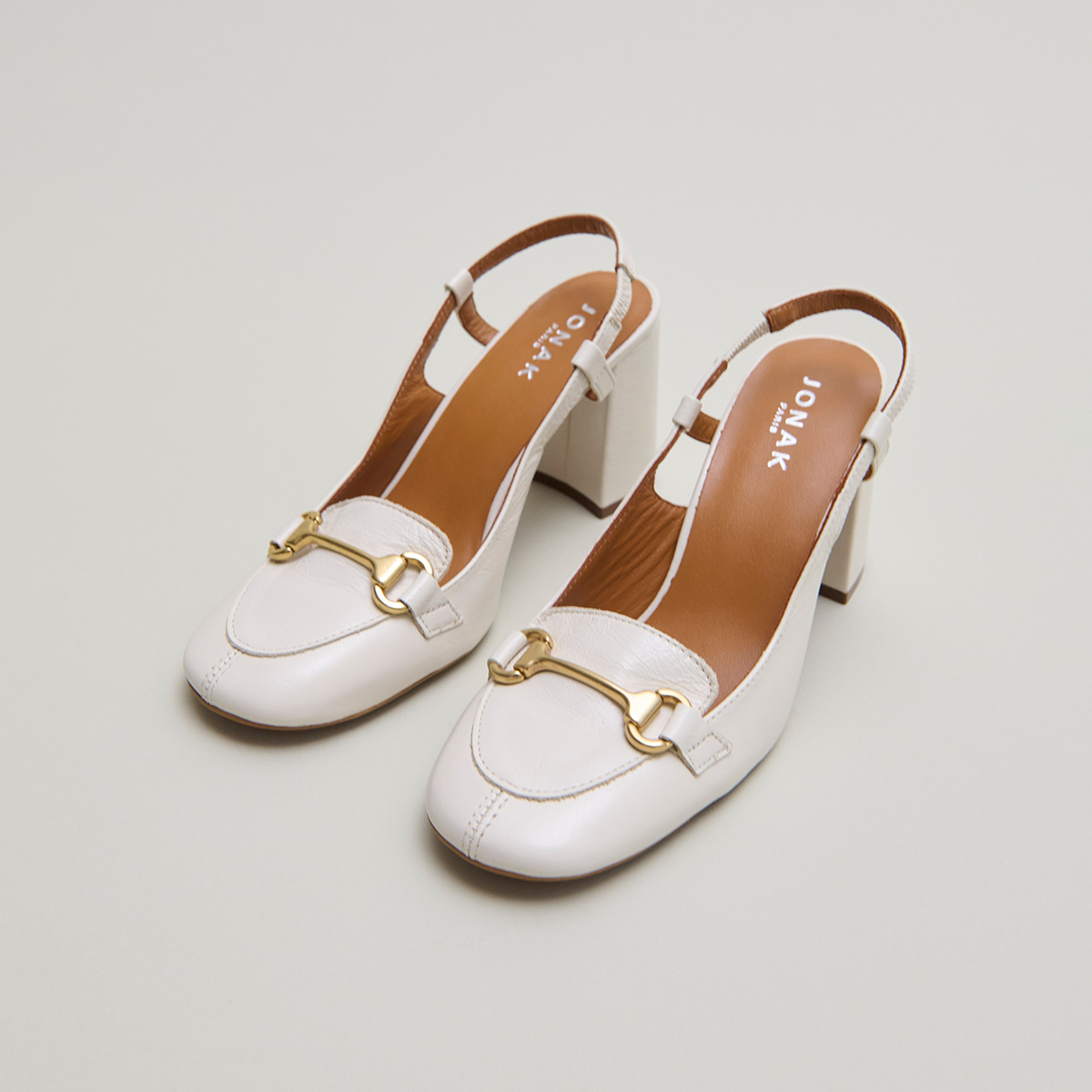 Slingbacks with gold bits in ecru distressed leather | BASEL