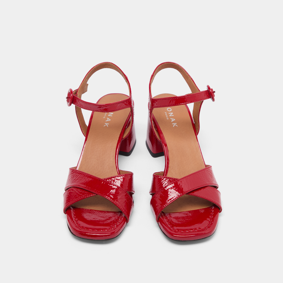 Heeled sandals in red pleated varnish | BRIELLA