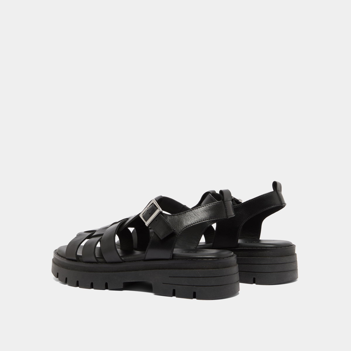 Sandals with notched soles in black leather | ANASTASIA
