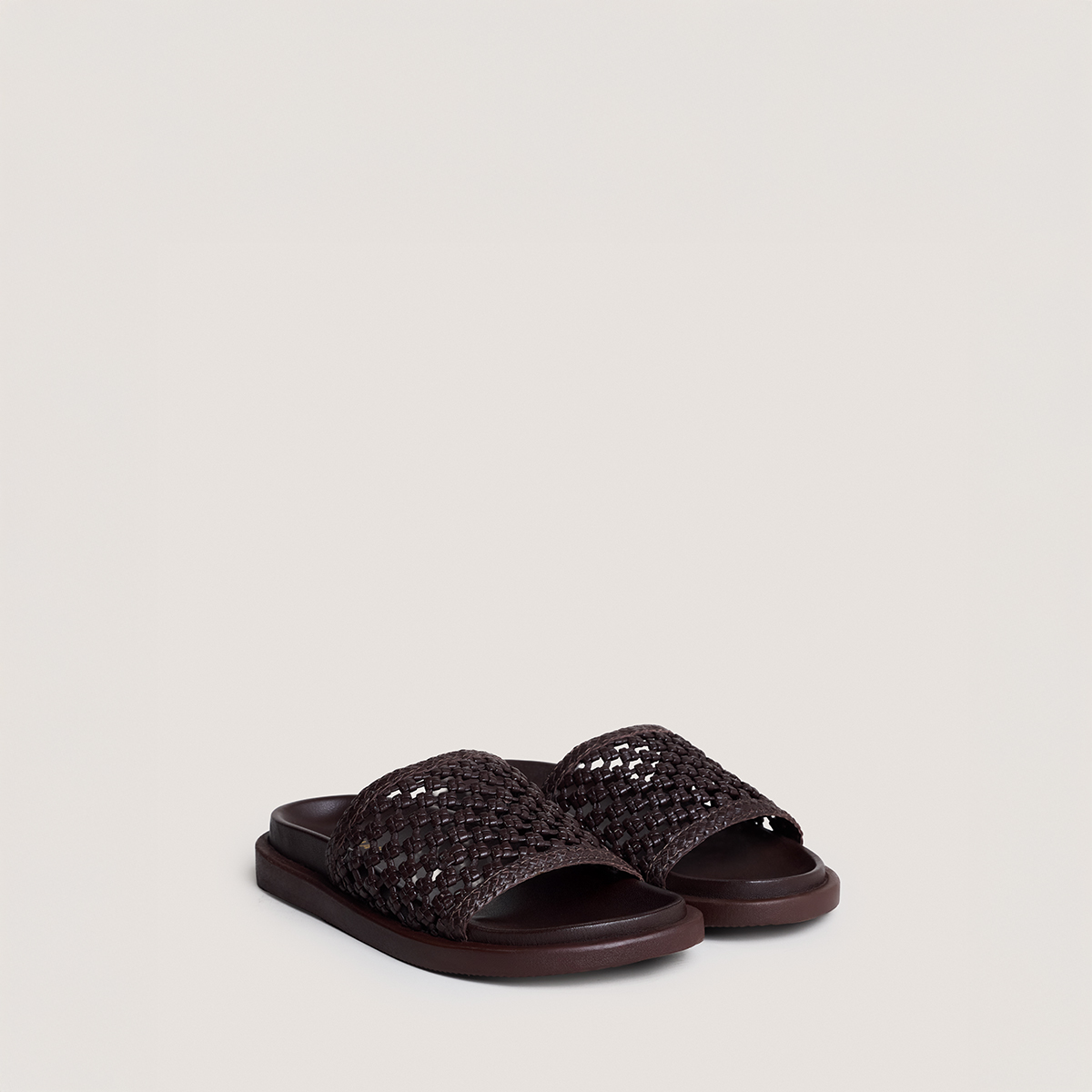 Openwork mules in dark brown leather | WOZART