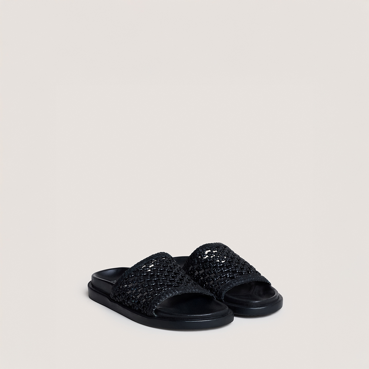 Openwork mules in black leather | WOZART