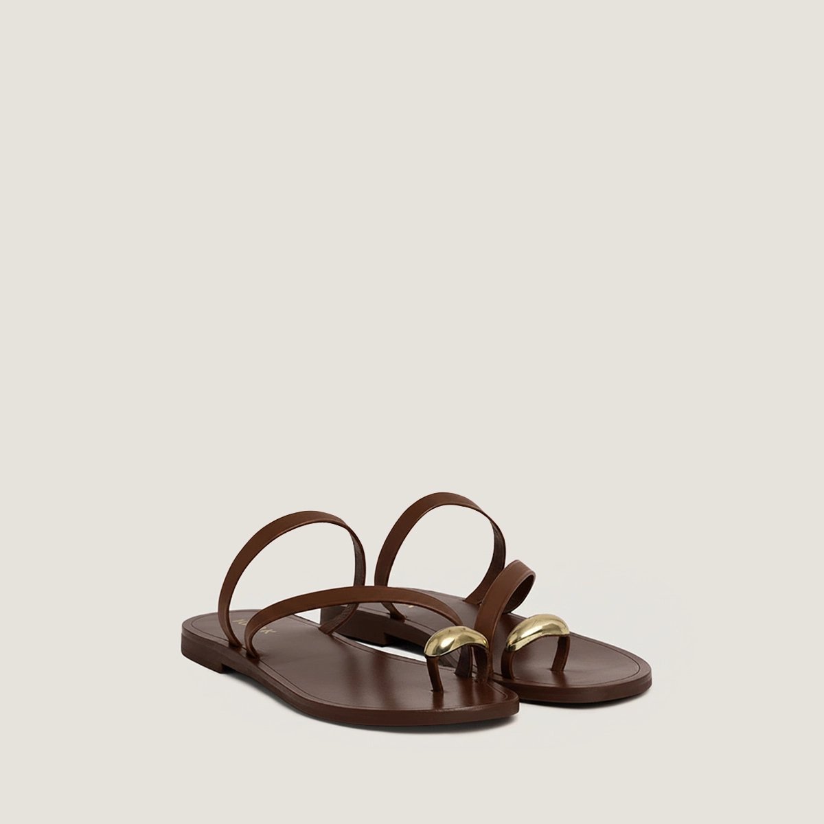 Sandals with slender straps and gold details in dark brown leather | WIFE
