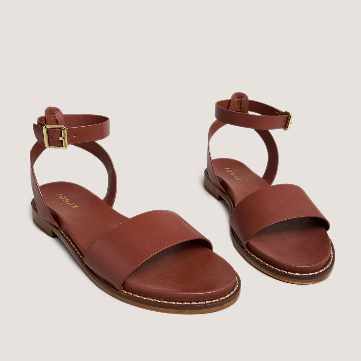 Sandals with straps and adjustable buckles in cognac leather | WIK