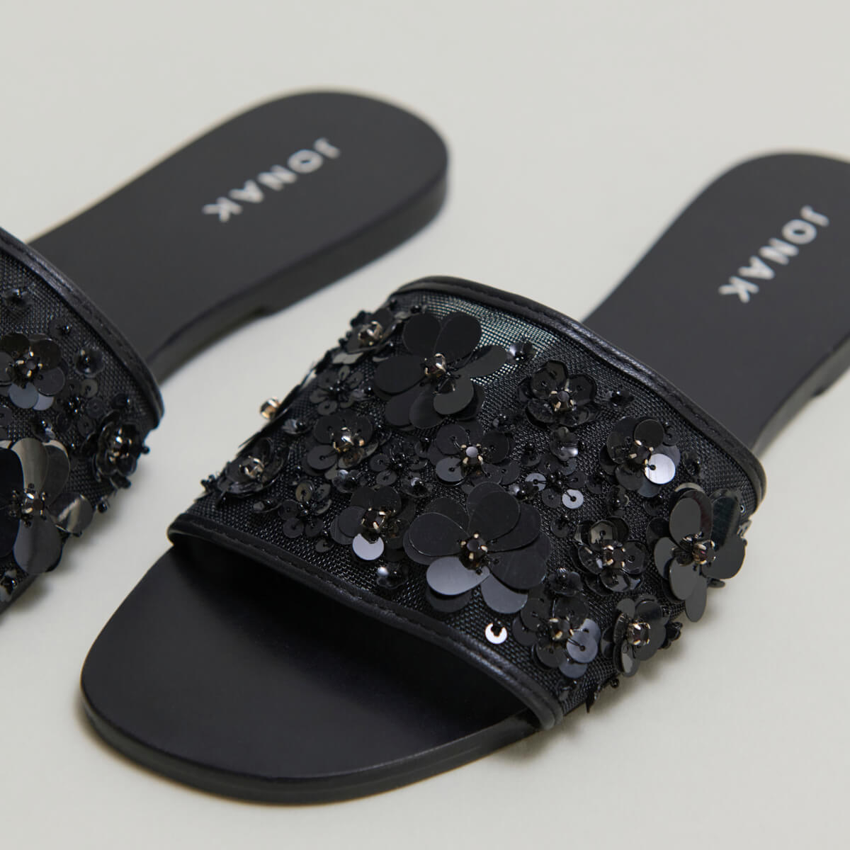 Beach sandals with flowers in black leather and black textile | SUN